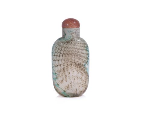 A SANDWICHED GLASS SNUFF BOTTLE
Rectangular form with rounded sides, semi-opaque white glass decorated with green and olive-b