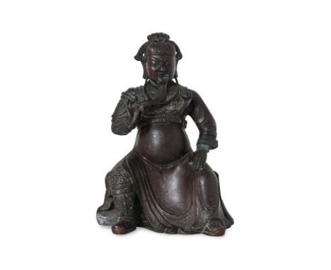 A SEATED BRONZE FIGURE OF GUANDI 17th/18th Century, modelled with eyes closed in pensive expression, right hand raised and st