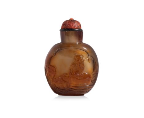 A CARVED AGATE 'WATER BUFFALO AND BOY' SNUFF BOTTLE
Compressed oviform bottle in amber and brown tones, decorated in quatrefo