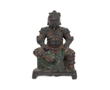 A SEATED LACQUERED BRONZE FIGURE OF GUANDI Ming dynasty, 16th/17th century, modelled wearing armour over robe, foo lion chest