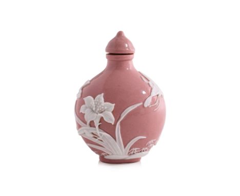 A WHITE OVERLAY BUTTERFLY AND OPAQUE PINK GLASS SNUFF BOTTLE
Wide circular form bottle decorated in butterflies and flowers, 