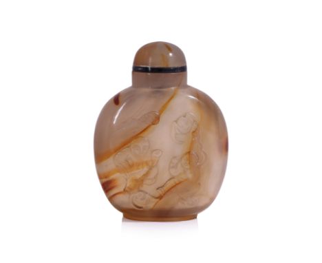 AN AGATE SNUFF BOTTLE
19th/20th Century, semi-transparent agate with orange-brown bands, relief carved decoration of two boys