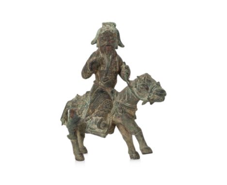 AN EQUESTRIAN BRONZE FIGURE OF GUANDI Modelled wearing robe over armour, right arm raised and left hand holding reigns, mount