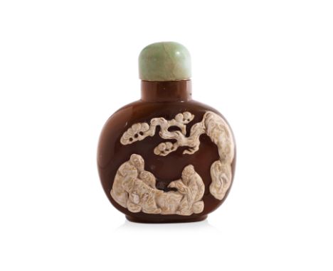 A CAMEO AGATE SNUFF BOTTLE
Compressed oviform bottle in caramel tones with relief carved white cameo, three older gentlemen p
