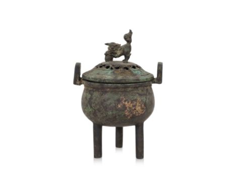 A BRONZE TRIPOD CENSER
Circular squat form censer with two squared lugs, pierced cover with foo lion finial, three vertical t