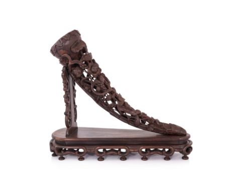 A LARGE BLACKWOOD TUSK FORM LOTUS CARVING, ON STAND
Carved in the form of a reticulated lotus with intertwined stems, flowers