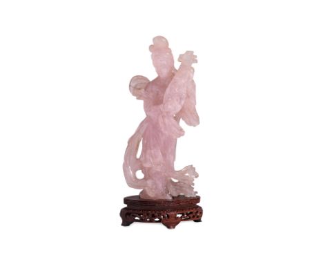 A ROSE QUARTZ CARVED FIGURE OF A LADY
Modelled wearing floating celestial shawl and playing pipa instrument, on hardwood stan