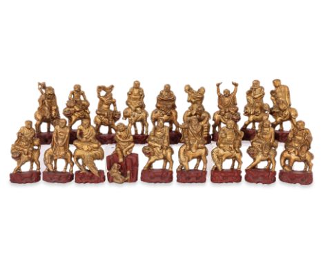 A SET OF EIGHTEEN CARVED GILTWOOD LUOHANS
20th Century, all modelled with their respective attributes, on red painted base
16