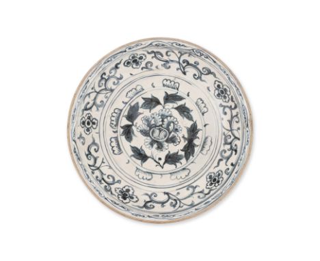 A LARGE VIETNAMESE BLUE AND WHITE LOTUS DISH
Circa 15th century, decorated in central lotus floret with leaf border, foliate 
