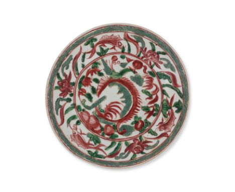 A SWATOW POLYCHROME DISH
Late Ming dynasty, decorated in central foliate panel, fish and foliage to the cavetto, partially gl