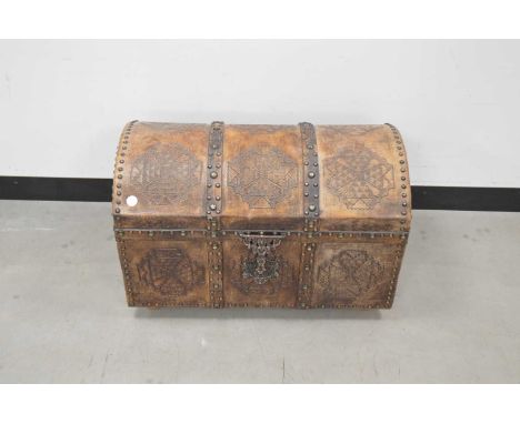 A vintage African wooden and metal bound domed lidded trunk, 72cm wide