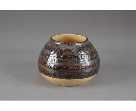 A studio pottery stoneware pot, with a copper glaze, incised R. Turner, possibly by Robert Turner, 12.5cm high