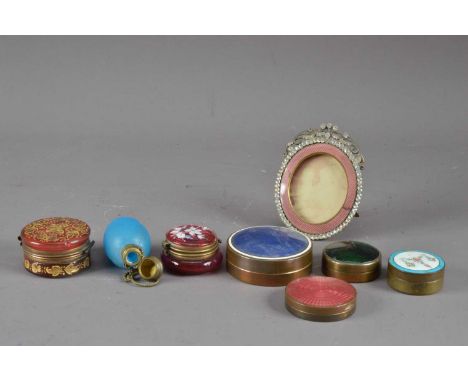 A collection of dressing table items, comprising two enamel toped trinket containers, both with brass cases, the largest 6.5c