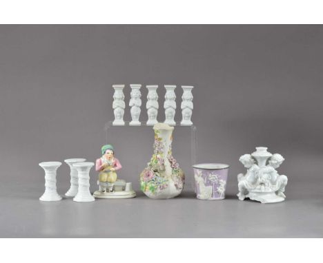 An assorted collection of 20th century ceramics, comprising a blanc-de-chine damaged decorative candlestick, the column with 