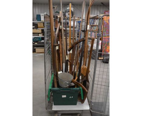 A large collection of assorted antique and later farming and agricultural tools,  including a single farrow seed drill, with 
