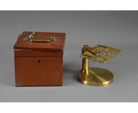 An R&J Beck brass microscope, in a mahogany box, the microscope damaged, AF, the circular based with makers mark, approx. hei