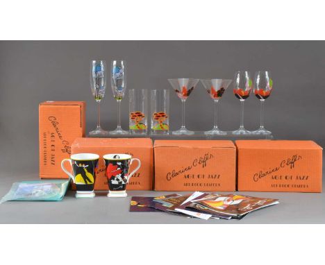 A collection of Modern Clarice Cliff, including four boxes of pairs of mugs, a selection of pairs of glasses, the champagne f