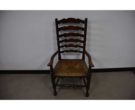 An antique mixed wood ladder back chair, AF