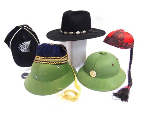 ASSORTED HEADGEAR  comprising two North Vietnamese military helmets, one with badge, both with liner and chin strap. a U.S. S