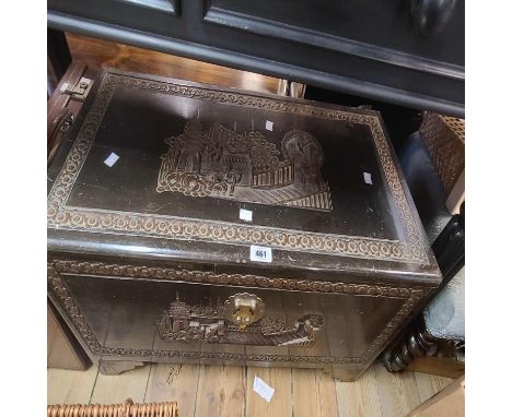 A 76cm vintage Chinese carved and stained camphor wood lift-top linen chest with figural and building decoration to top and f