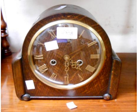 A vintage oak cased mantel clock with Smiths Enfield eight day gong striking movement