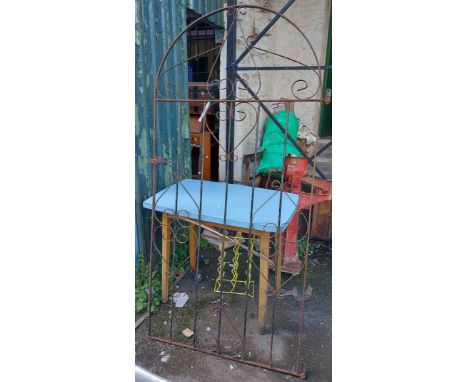 A arched top wrought iron gate