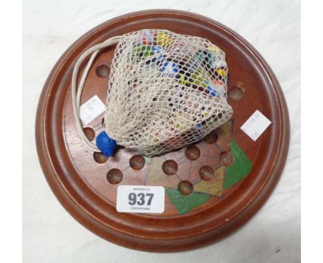 A vintage treen solitaire board game, with later reapplied paint and marbles
