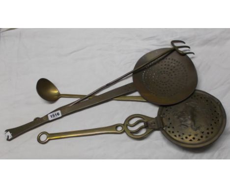 An antique brass cream skimmer dated and signed to handle O. Knight 1760 - sold with a toasting fork, ladle and chestnut roas