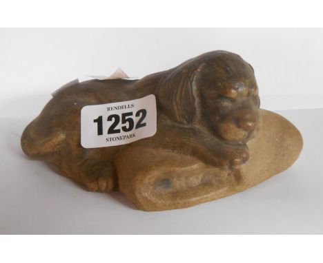 A Barbara Linney-Adams design Poole Pottery figurine, depicting a puppy sleeping on a slipper with brown glazed finish