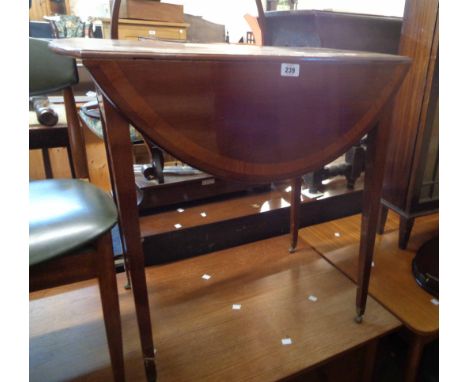 A 76cm 19th Century mahogany and cross banded Pembroke table, set on square tapered legs with roller casters