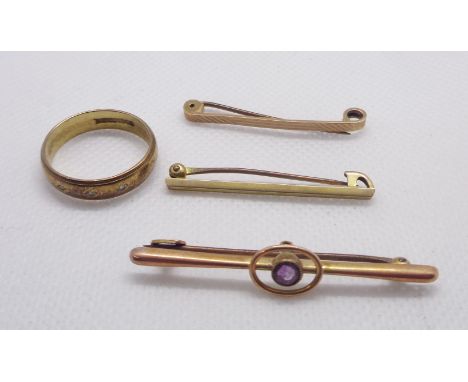 A marked 9ct. rose metal and amethyst set bar brooch - sold with two other marked 9ct. bar brooches and a 375 (9ct.) gold wed