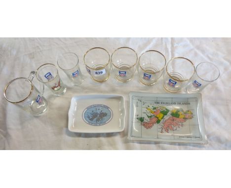 A quantity of Falkland Islands souvenir items comprising gilt edged and other crested drinking glasses and ceramic dishes