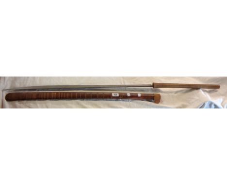 An antique East Asian Dha sword and scabbard