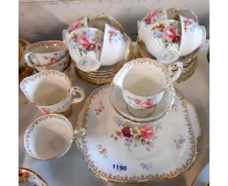 A Crown Staffordshire bone china part tea set decorated in the 'England Bouquet' pattern including cups, saucers, tea plates,