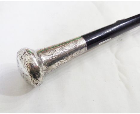 A London silver topped ebonised walking stick with engraved scroll decoration to handle