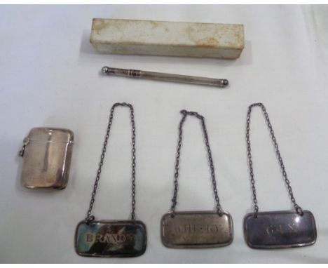 A silver vesta case - sold with a harlequin set of three silver decanter labels and a boxed marked 'sterling silver' swizzle 