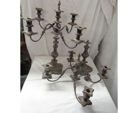 A pair of 54cm antique silver plated copper ornate four branch five light candelabra with flambeau finials and detachable noz