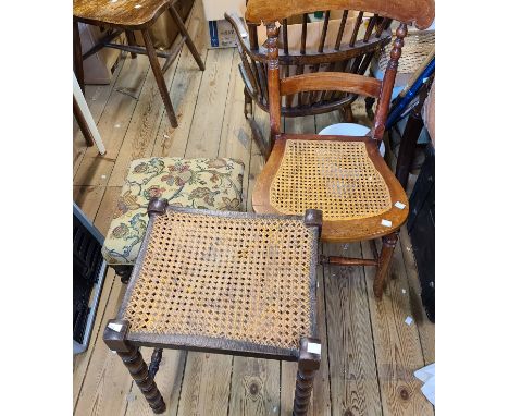 An early 20th Century stained oak dressing stool with rattan seat panel, set on bobbin turned supports - sold with an old foo