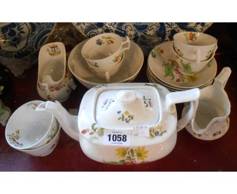 A 19th Century Staffordshire bone china part tea set with floral decoration including teapot, cups and saucers, etc. - sold w