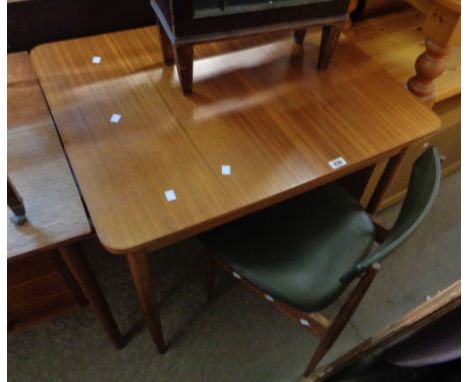 An 85cm Retro Vanson teak effect kitchen table, set on simple tapered legs - sold with a pair of green vinyl upholstered dini
