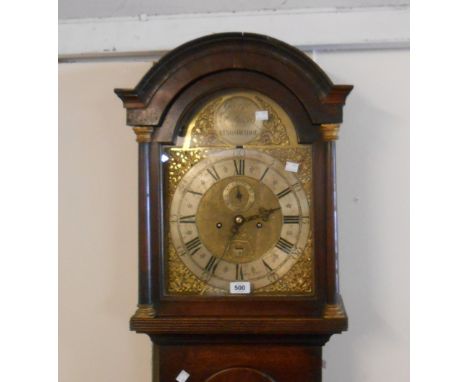 An 18th Century stained oak longcase clock, the 29cm brass and silvered arched dial marked for George Paddon of Kingsbridge w