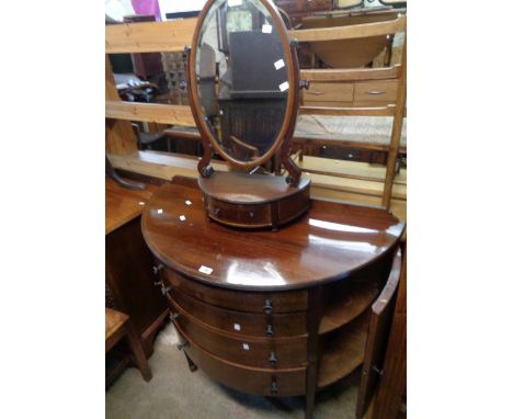 A 1.05m Edwardian mahogany and strung demi-lune sideboard with central flight of four long graduated drawers and flanking cup