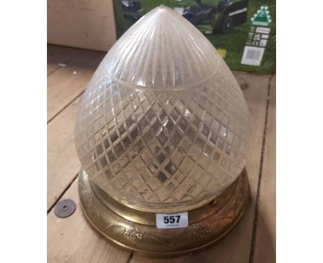 A vintage ceiling lamp with pointed cut glass shade and brass fittings