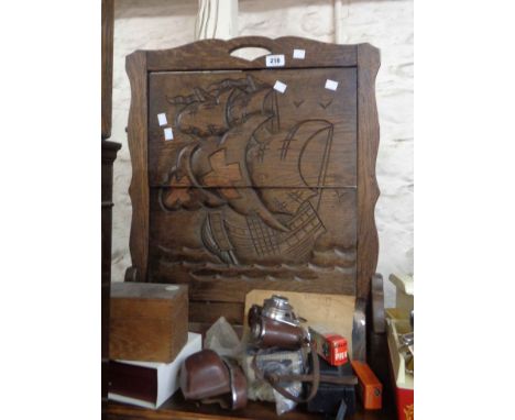 A vintage oak two tier folding cake stand with carved galleon decoration, set on splayed feet