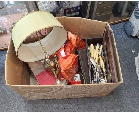 A box containing a quantity of silver plated and other items including three branch table lamp, cutlery, etc.