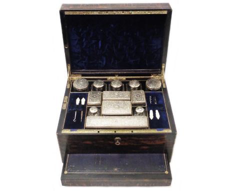 A Victorian brass bound coromandel wood travelling toilet/vanity box with twelve engraved and initialed (ACC) silver topped c