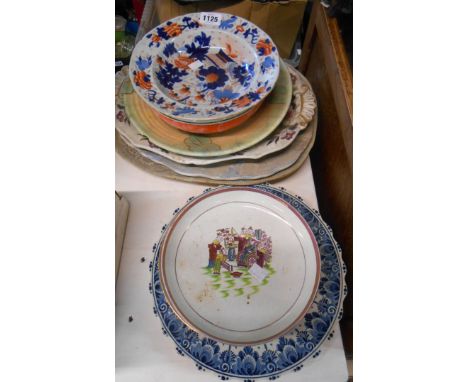 A quantity of ceramic plates and chargers including antique Chinese porcelain plate with blue painted decoration depicting bi