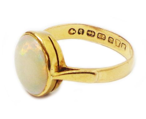 A 22ct. gold ring, set with oval cabochon milky opal - size P 1/2 - boxed