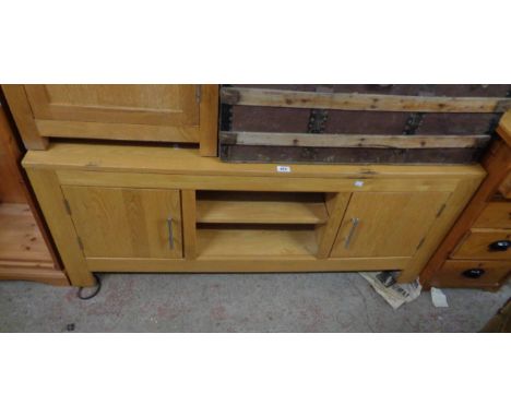 A 1.39m modern golden oak media cabinet with central open shelf and flanking cupboards