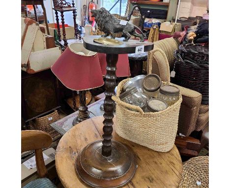 A vintage oak smoker's standard with applied spelter lion and brass ashtray to top, set on turned pillar and circular base